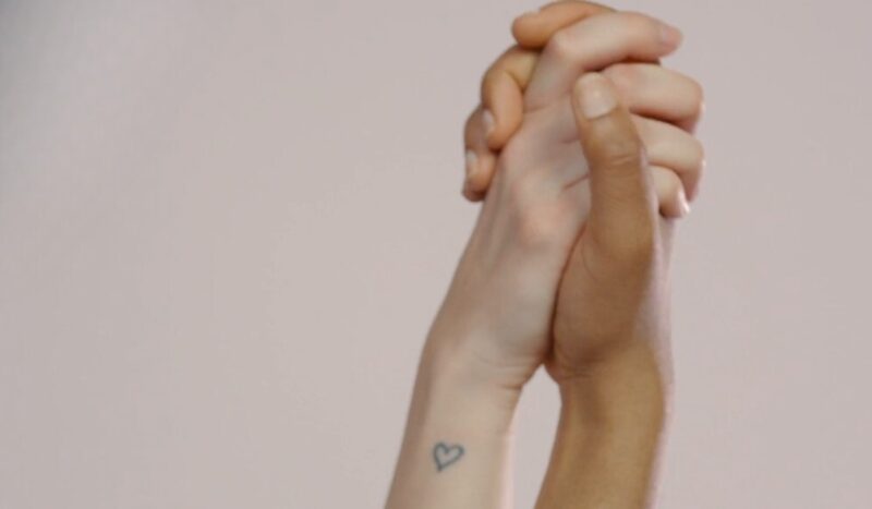 Minimalist heart tattoo on the arm